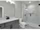 Bathroom featuring a marble-tiled shower, sleek vanity, and modern fixtures, creating a luxurious space at 3745 Pilgrim Mill Rd, Cumming, GA 30041