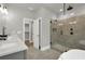 Beautiful bathroom with a modern glass shower, double vanity, and stylish fixtures at 3745 Pilgrim Mill Rd, Cumming, GA 30041