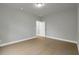 Open bedroom featuring wood flooring and a doorway creating a spacious and inviting atmosphere at 3745 Pilgrim Mill Rd, Cumming, GA 30041