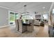 Open concept dining room with modern chandelier and sliding glass doors to outdoor space at 3745 Pilgrim Mill Rd, Cumming, GA 30041