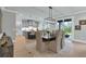 Elegant dining area features a modern light fixture and connects to the kitchen at 3745 Pilgrim Mill Rd, Cumming, GA 30041