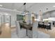 The dining area flows into the kitchen, featuring modern lighting and stylish seating at 3745 Pilgrim Mill Rd, Cumming, GA 30041