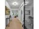 Elegant entryway with light wood floors, decorative lighting, wainscoting and console table at 3745 Pilgrim Mill Rd, Cumming, GA 30041