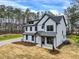Charming two-story home with a modern farmhouse style and a well-manicured front yard at 3745 Pilgrim Mill Rd, Cumming, GA 30041