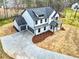 A spacious two-story house, featuring an attached two-car garage and long concrete driveway at 3745 Pilgrim Mill Rd, Cumming, GA 30041
