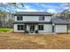 Exterior of a two-story home showcasing a covered back patio and large yard at 3745 Pilgrim Mill Rd, Cumming, GA 30041