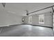 Spacious two car garage with concrete floor and two windows at 3745 Pilgrim Mill Rd, Cumming, GA 30041
