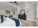 Spacious main bedroom with a tray ceiling, modern ceiling fan, and contemporary decor at 3745 Pilgrim Mill Rd, Cumming, GA 30041