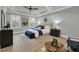 A spacious main bedroom suite with a trey ceiling, modern ceiling fan and hardwood floors at 3745 Pilgrim Mill Rd, Cumming, GA 30041