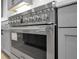 Close up of a stainless steel oven with gray cabinets in the background at 3745 Pilgrim Mill Rd, Cumming, GA 30041