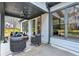 Covered patio with cushioned seating and ceiling fan provides a relaxing space at 3745 Pilgrim Mill Rd, Cumming, GA 30041