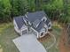 Beautiful new home featuring a long driveway, landscaping, and an attached two-car garage at 3780 Tamiami Trl, Cumming, GA 30041