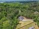 Wide aerial view showing a new build, adjacent land, and Lake Lanier in the distance at 3780 Tamiami Trl, Cumming, GA 30041