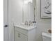 Cozy bathroom featuring white cabinetry, a modern faucet, and neutral paint at 3780 Tamiami Trl, Cumming, GA 30041