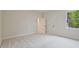 Bright, airy bedroom with neutral carpet and walls, offering a serene atmosphere at 3780 Tamiami Trl, Cumming, GA 30041
