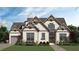 Charming two-story craftsman home featuring a landscaped yard, shingle accents, and a welcoming front entrance at 3780 Tamiami Trl, Cumming, GA 30041
