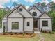 Beautiful home with stone accents, well maintained landscaping and a stone walkway to the front door at 3780 Tamiami Trl, Cumming, GA 30041