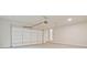 Large garage with door, steps to an entry door, and overhead door opener at 3780 Tamiami Trl, Cumming, GA 30041