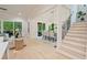Open-concept living room and dining area with abundant natural light and hardwood floors at 3780 Tamiami Trl, Cumming, GA 30041