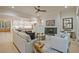 Bright open-concept living space with fireplace, hardwood floors, and seamless flow to the kitchen at 3780 Tamiami Trl, Cumming, GA 30041