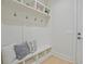 Bright mudroom with built-in bench seating, storage cubbies, and convenient coat hooks at 3780 Tamiami Trl, Cumming, GA 30041