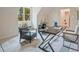 Well-lit office featuring a modern desk, chair, and stylish interior elements at 3780 Tamiami Trl, Cumming, GA 30041