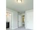 Hallway featuring carpet flooring, flush mount lighting, and various doorways at 5390 Deer Run Dr, Conyers, GA 30094