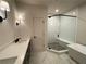 Modern bathroom showcasing white marble floors, double vanity, soaking tub, and glass shower at 160 Chiswick Cir, Alpharetta, GA 30009