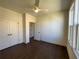 Bedroom with dark hardwood floors, white trim, and large windows for natural light at 160 Chiswick Cir, Alpharetta, GA 30009