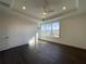 Spacious bedroom with large windows and wood flooring and a tray ceiling at 160 Chiswick Cir, Alpharetta, GA 30009