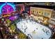 Festive outdoor ice-skating rink surrounded by shops, lights, and winter decor at 160 Chiswick Cir, Alpharetta, GA 30009