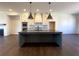 Modern kitchen with a large island, stainless steel appliances, and white cabinets at 160 Chiswick Cir, Alpharetta, GA 30009