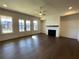 Living room with hardwood floors, fireplace and glass french doors at 160 Chiswick Cir, Alpharetta, GA 30009