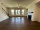 Spacious living room featuring a fireplace, staircase and hardwood floors at 160 Chiswick Cir, Alpharetta, GA 30009