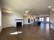 Spacious living room featuring hardwood floors, a fireplace, and an open concept layout at 160 Chiswick Cir, Alpharetta, GA 30009