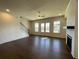 Bright living room with hardwood floors, fireplace and staircase at 160 Chiswick Cir, Alpharetta, GA 30009