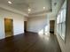 A spacious main bedroom featuring wood floors, natural light, and an ensuite bathroom at 160 Chiswick Cir, Alpharetta, GA 30009