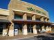 Exterior shot of a Whole Foods Market, showing storefront, entrance, and surrounding sidewalk at 160 Chiswick Cir, Alpharetta, GA 30009