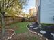 Small grassy backyard with stone path and fence at 962 Rittenhouse Way, Atlanta, GA 30316