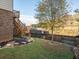 Landscaped backyard with deck, stairs, and a tree at 962 Rittenhouse Way, Atlanta, GA 30316