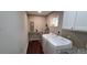 Clean laundry room with washer, dryer, and built-in shelving at 2756 Gresham Se Rd, Atlanta, GA 30316