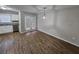 Bright dining area with hardwood floors, a modern pendant light, and access to a patio at 6500 Wellington Chase Ct, Lithonia, GA 30058