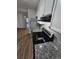 Kitchen featuring granite countertops and stainless steel appliances, and view into entry at 6500 Wellington Chase Ct, Lithonia, GA 30058