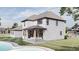 Rear view of a two-story home with a pool and covered patio at 1276 A Rutledge Rd, Acworth, GA 30101