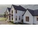 Side view of two-story white brick home with black trim at 1276 A Rutledge Rd, Acworth, GA 30101