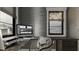 Home office with built-in desk and stylish gray walls at 1276 A Rutledge Rd, Acworth, GA 30101