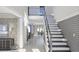 Modern staircase with glass railing and gray wall accents at 1276 A Rutledge Rd, Acworth, GA 30101
