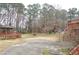 Large backyard with gazebo, deck, basketball court, and trees at 2068 Lakewood Cir, Grayson, GA 30017