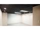 Finished basement room with grey flooring and a black ceiling at 2068 Lakewood Cir, Grayson, GA 30017