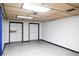 Spacious basement room with gray flooring and closets at 2068 Lakewood Cir, Grayson, GA 30017